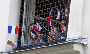 Children wave French flags