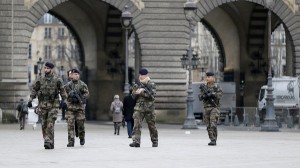 French soldiers patrol near the Louvre Museum in Paris as part of the highest level of "Vigipirate" security plan, the day after a shooting at the Paris offices of Charlie Hebdo